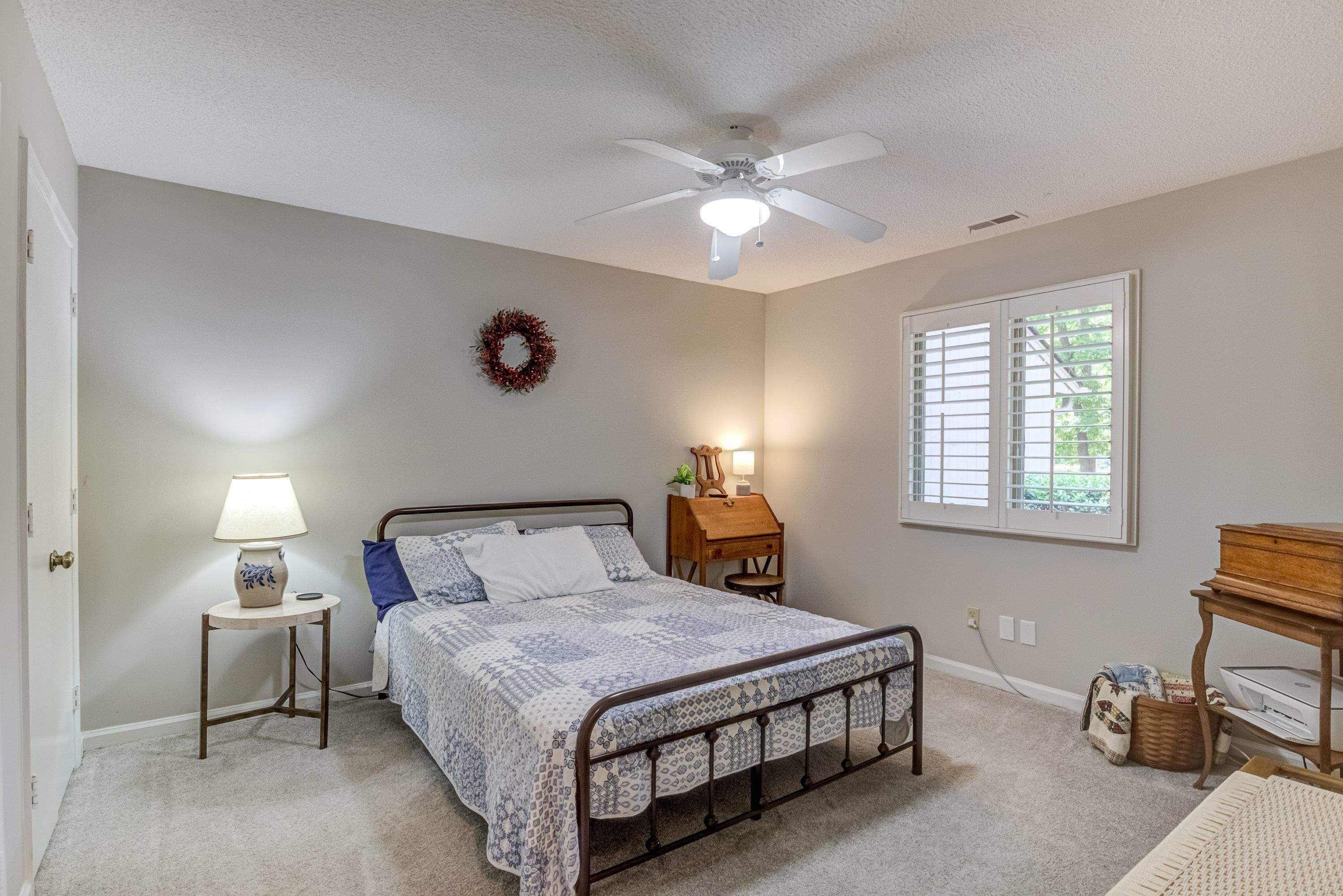 705 Tan Tara Square Raleigh, NC 27615 - Photo 25 of 31 a bedroom with a bed and a window