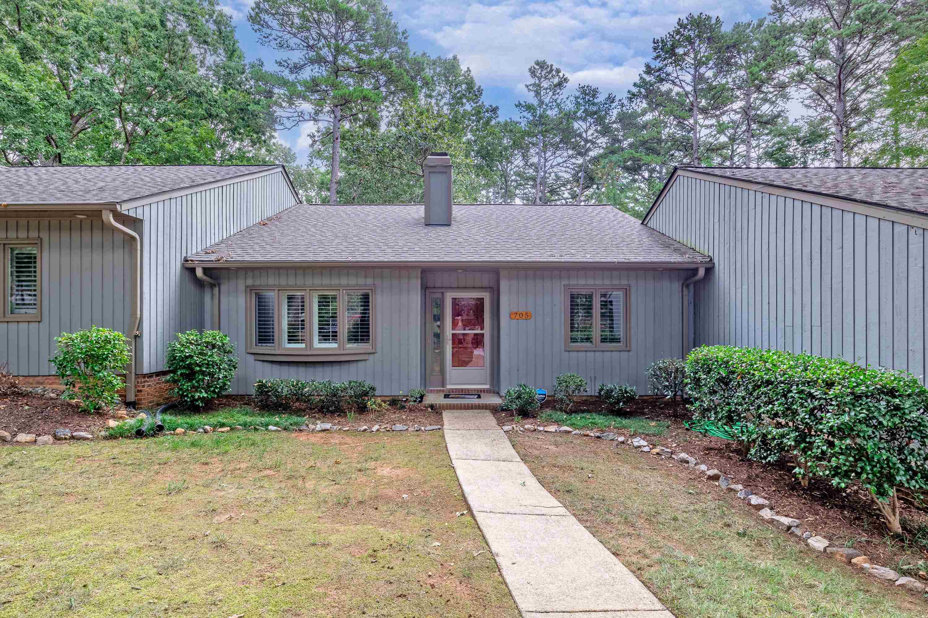 705 Tan Tara Square Raleigh, NC 27615 - Photo 3 of 31 a front view of a house with a garden