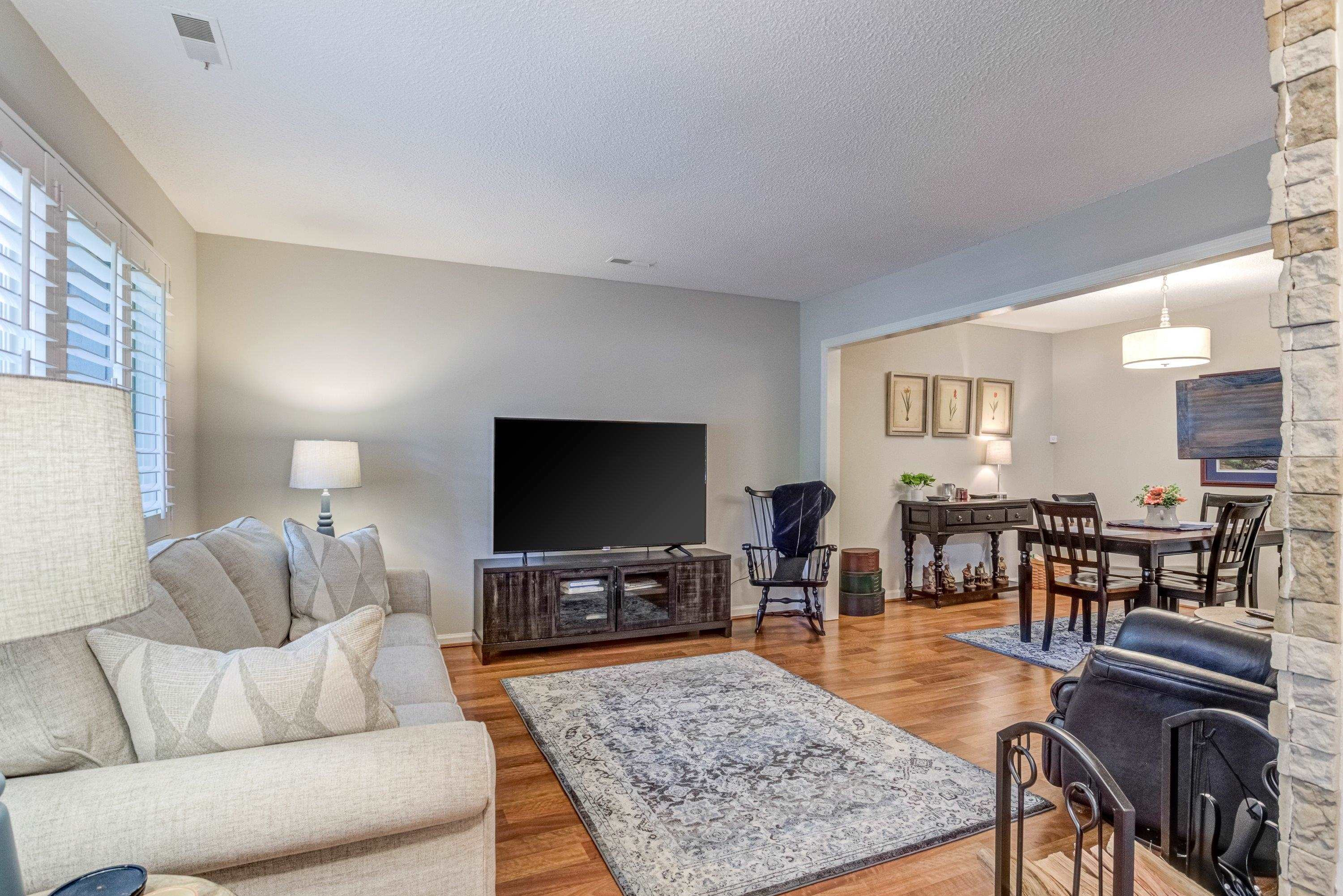 705 Tan Tara Square Raleigh, NC 27615 - Photo 10 of 31 a living room with furniture and a flat screen tv