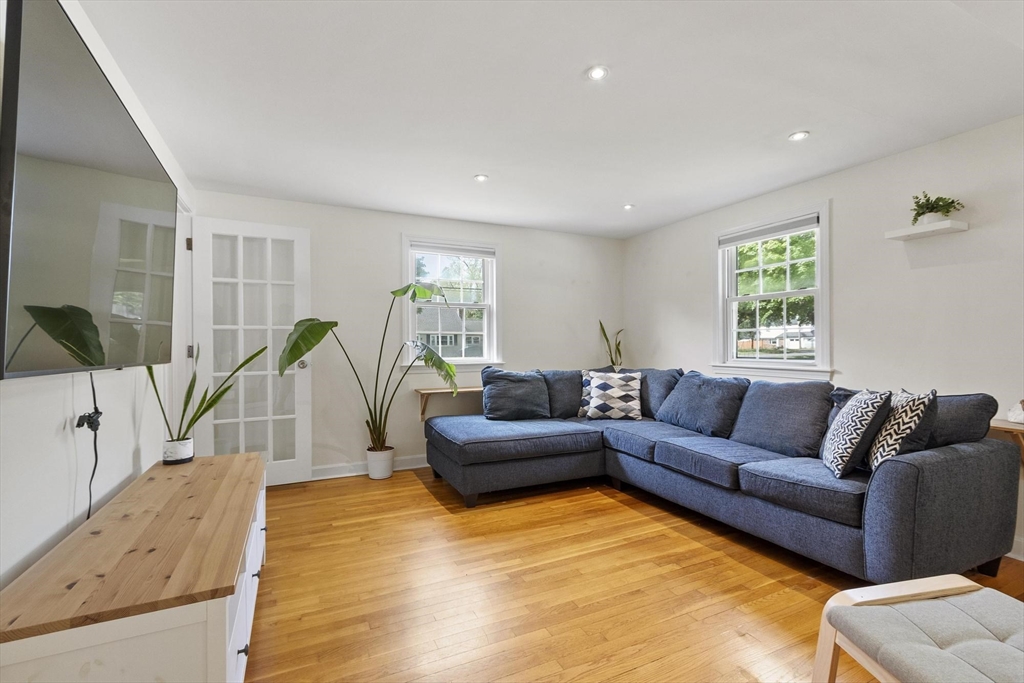 6 Edith Road Hudson, MA 01749 - Photo 10 of 30 a living room with furniture and a wooden floor