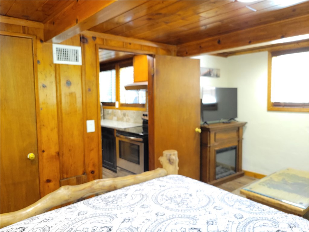 1116 Lark Road Wrightwood, CA 92397 - Photo 37 of 46 a bedroom with a bed and a dresser