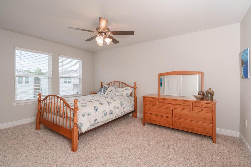 90 Crossing Lane, Unit B Santa Rosa Beach, FL 32459 - Photo 13 of 23 a bed room with a bed and a window