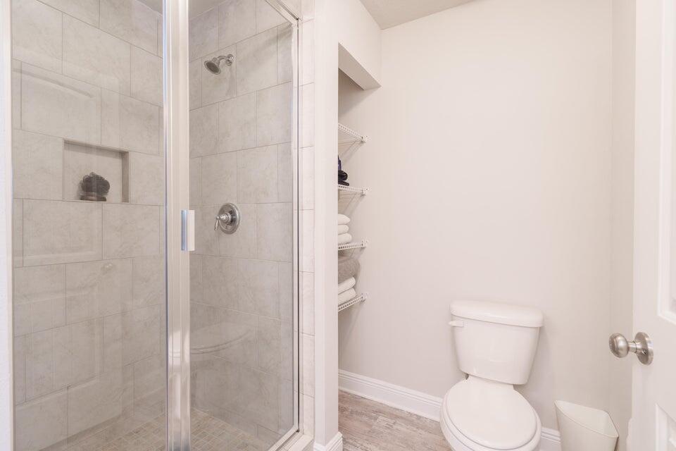 90 Crossing Lane, Unit B Santa Rosa Beach, FL 32459 - Photo 17 of 23 a bathroom with a toilet and shower
