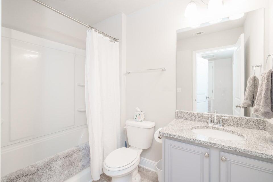 90 Crossing Lane, Unit B Santa Rosa Beach, FL 32459 - Photo 21 of 23 a bathroom with a granite countertop sink toilet and shower