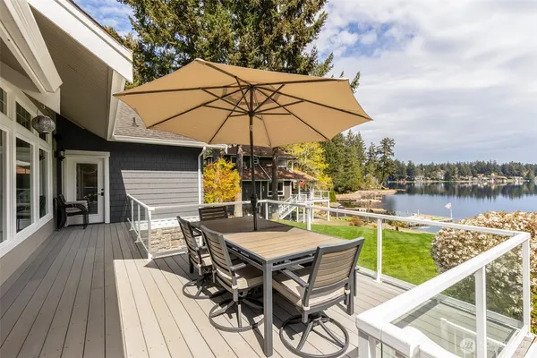 an outdoor space with furniture and umbrella