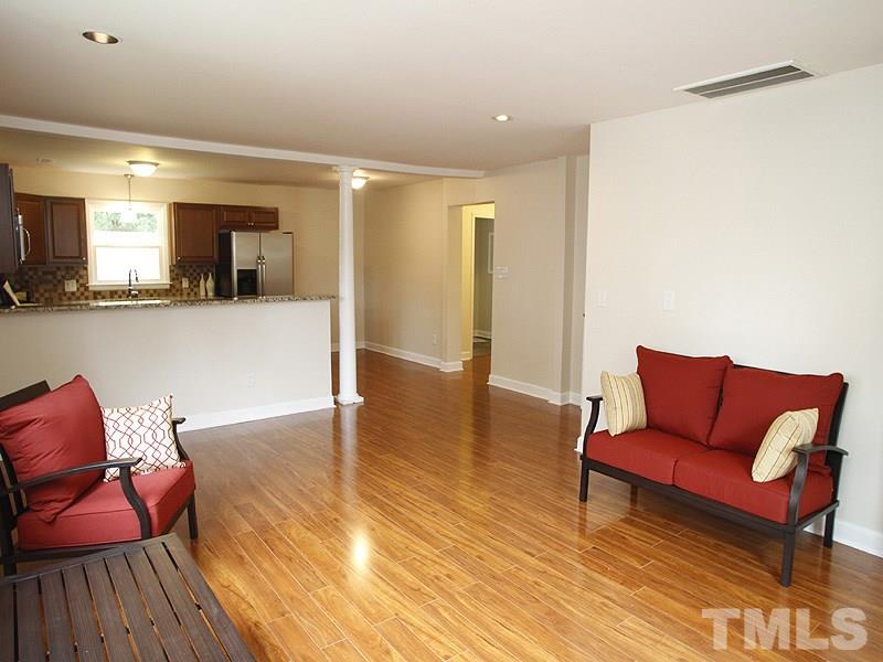 606 Frank Street Raleigh, NC 27604 - Photo 8 of 25 a living room with furniture and a wooden floor