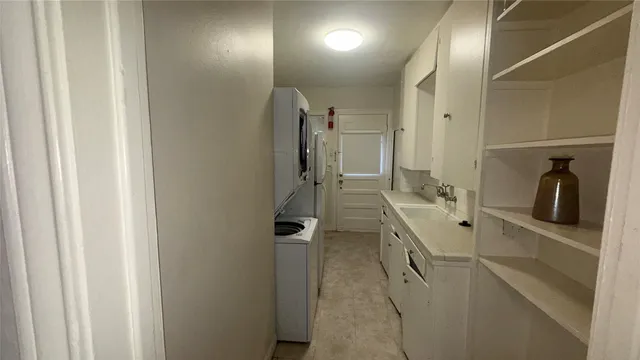 a bathroom with a walk in closet and mirror
