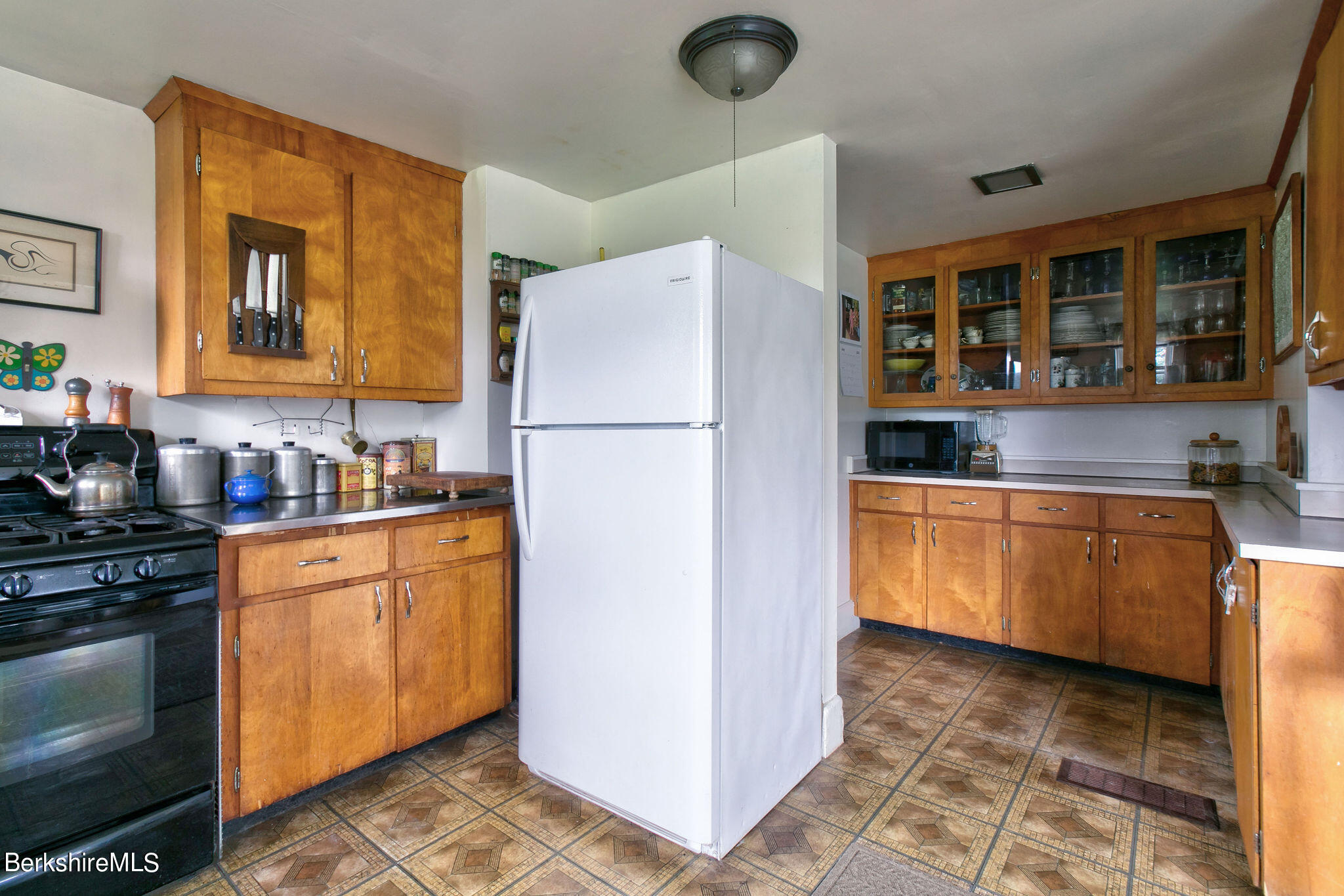 32 Prospect Hill Road Stockbridge, MA 01262 - Photo 17 of 30 a kitchen with granite countertop a refrigerator a stove top oven a sink and dishwasher