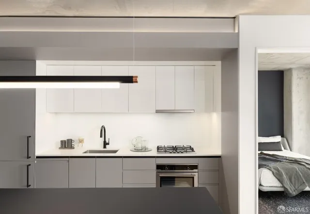 a kitchen with a sink and cabinets