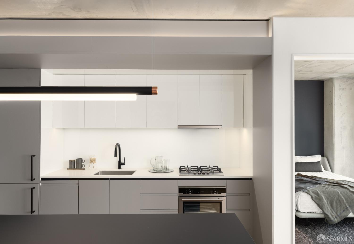 960 Market Street, Unit 807 San Francisco, CA 94102 - Photo 3 of 13 a kitchen with a sink and cabinets