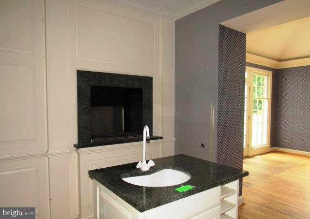 9207 Belmart Road Potomac, MD 20854 - Photo 11 of 13 a sink and a mirror