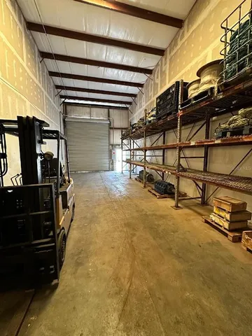 a view of an empty room with wooden walls