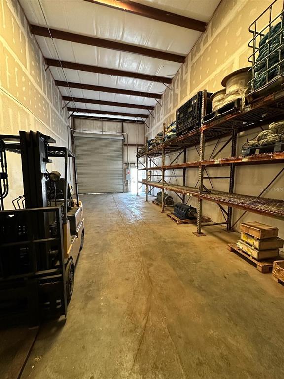 140 Oscar Hill Road Tarpon Springs, FL 34689 - Photo 3 of 3 a view of an empty room with wooden walls
