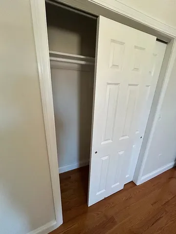 an empty room with wooden floor