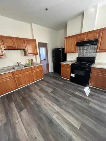 a living room with furniture fireplace and flat screen tv