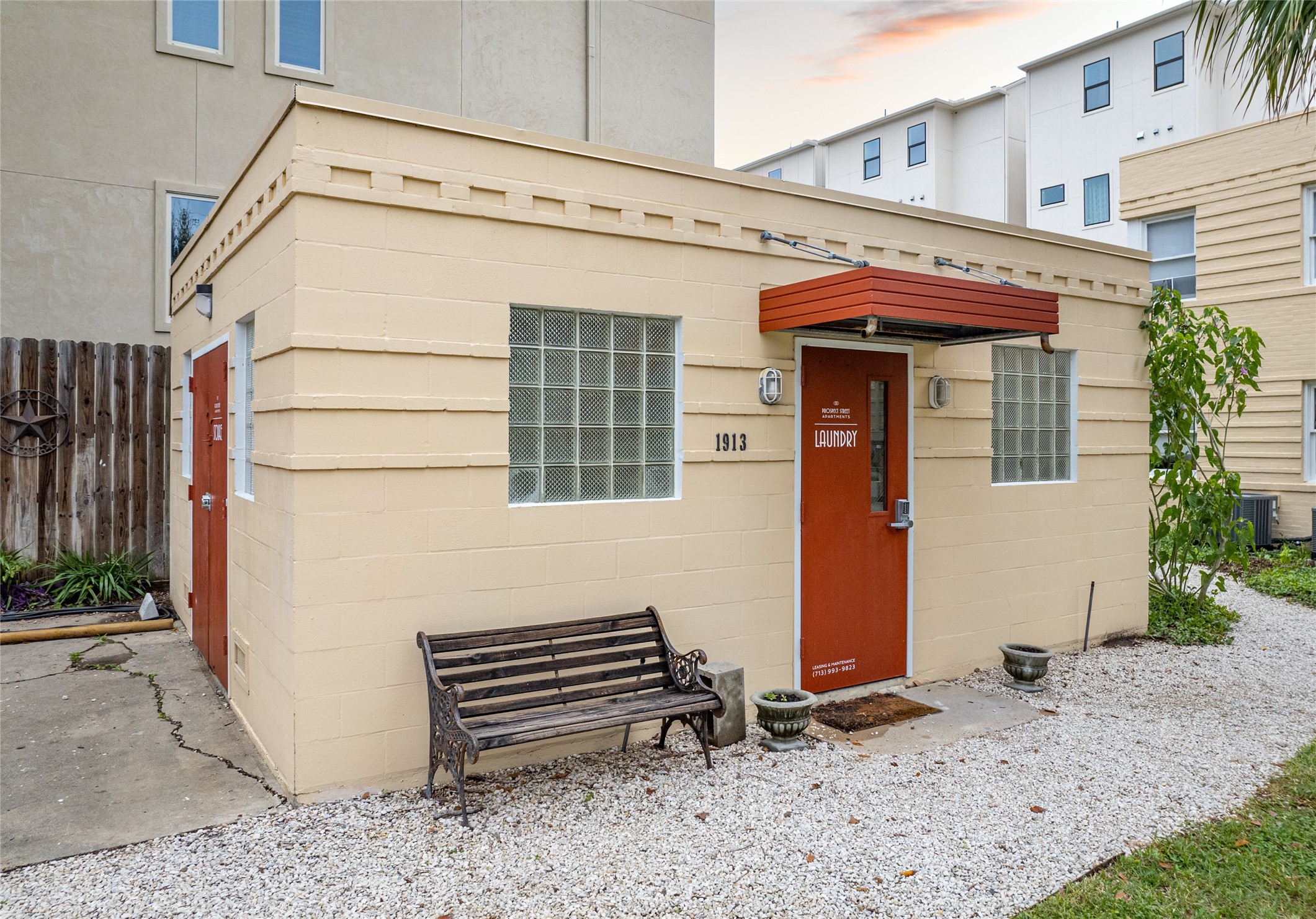 1913 Prospect Street, Unit 5 Houston, TX 77004 - Photo 17 of 17 a view of a house with a door and wooden bench
