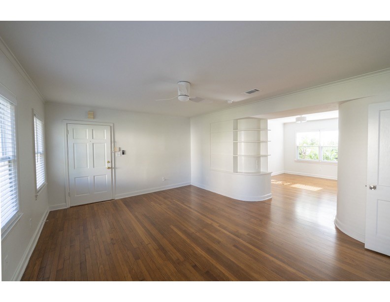 1913 Prospect Street, Unit 5 Houston, TX 77004 - Photo 8 of 17 a view of an empty room with wooden floor and a window