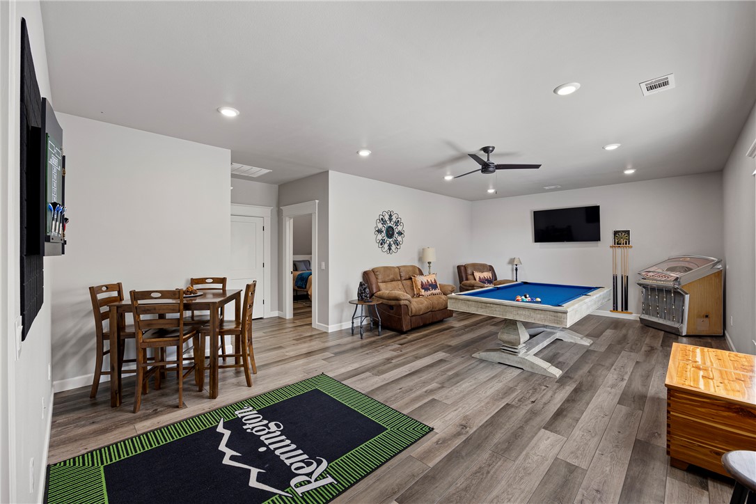3419 Bailey Loop Road London, AR 72847 - Photo 35 of 60 Spacious open-concept room featuring wood-finish flooring, recessed lighting, and a ceiling fan