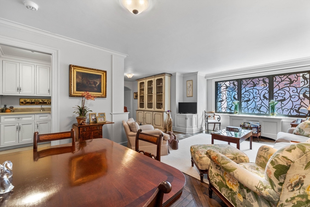 180 Beacon Street, Unit 9G Boston, MA 02116 - Photo 14 of 23 a living room with furniture and a painting on the wall
