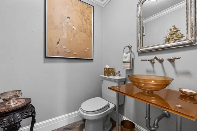 a bathroom with a toilet and a sink
