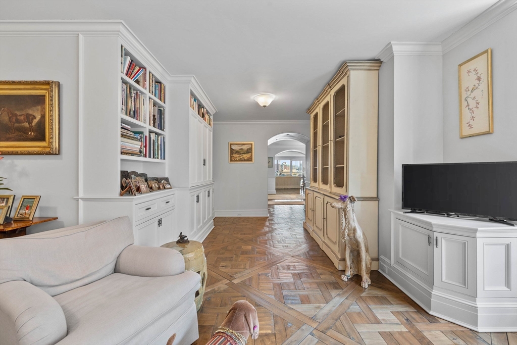 180 Beacon Street, Unit 9G Boston, MA 02116 - Photo 20 of 23 a living room with furniture and a flat screen tv