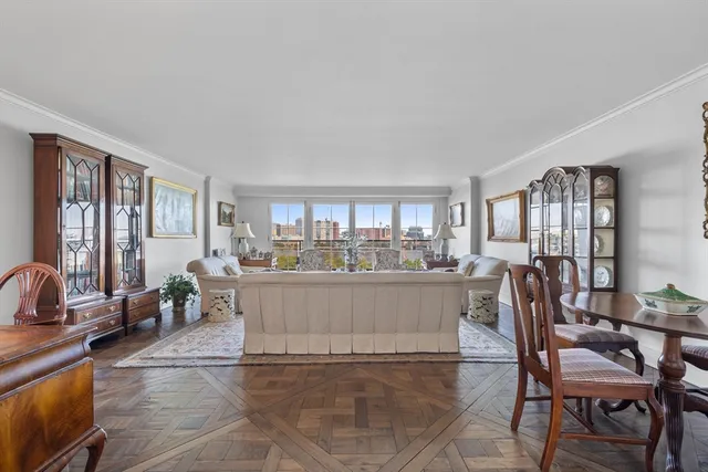 a view of a dining room with furniture and window