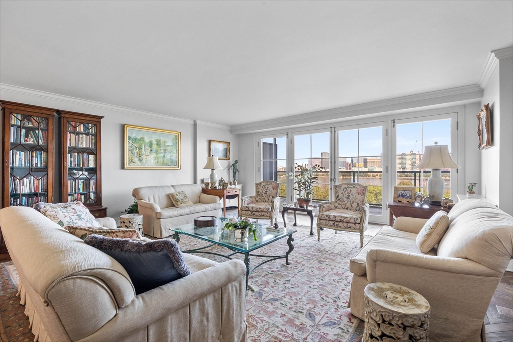 180 Beacon Street, Unit 9G Boston, MA 02116 - Photo 5 of 23 a living room with furniture and a large window