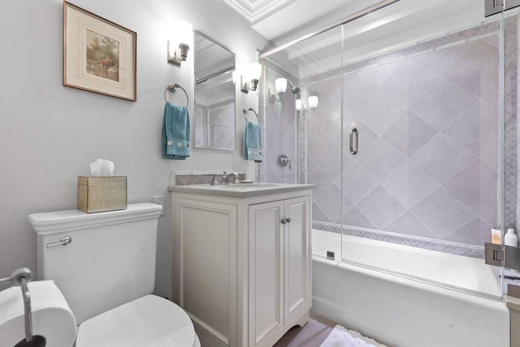180 Beacon Street, Unit 9G Boston, MA 02116 - Photo 8 of 23 a bathroom with a sink a toilet and shower