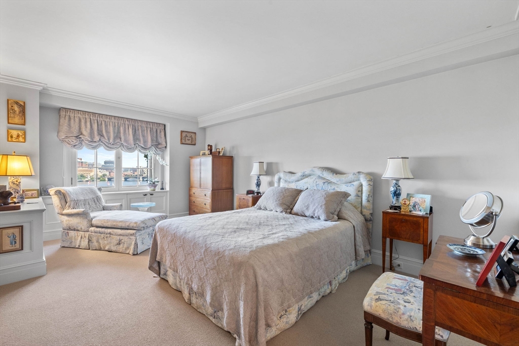 180 Beacon Street, Unit 9G Boston, MA 02116 - Photo 10 of 23 a bedroom with a bed and wooden floor