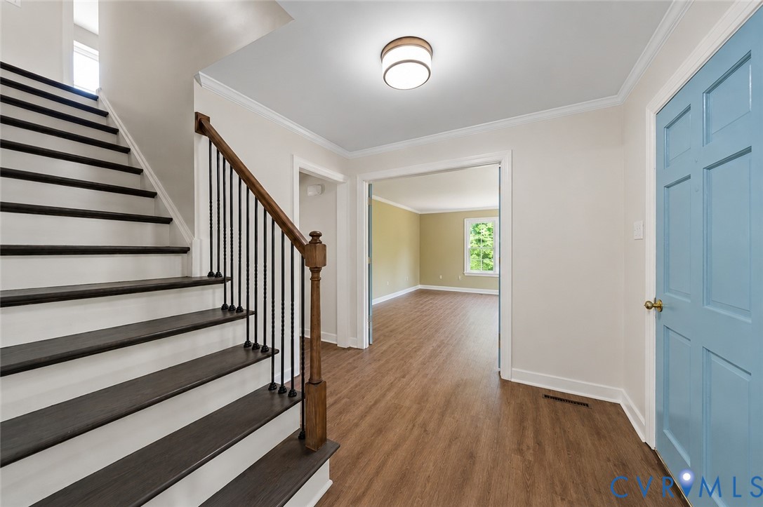 20010 River Road Chesterfield, VA 23838 - Photo 3 of 36 a view of a hallway with wooden floor and entryway