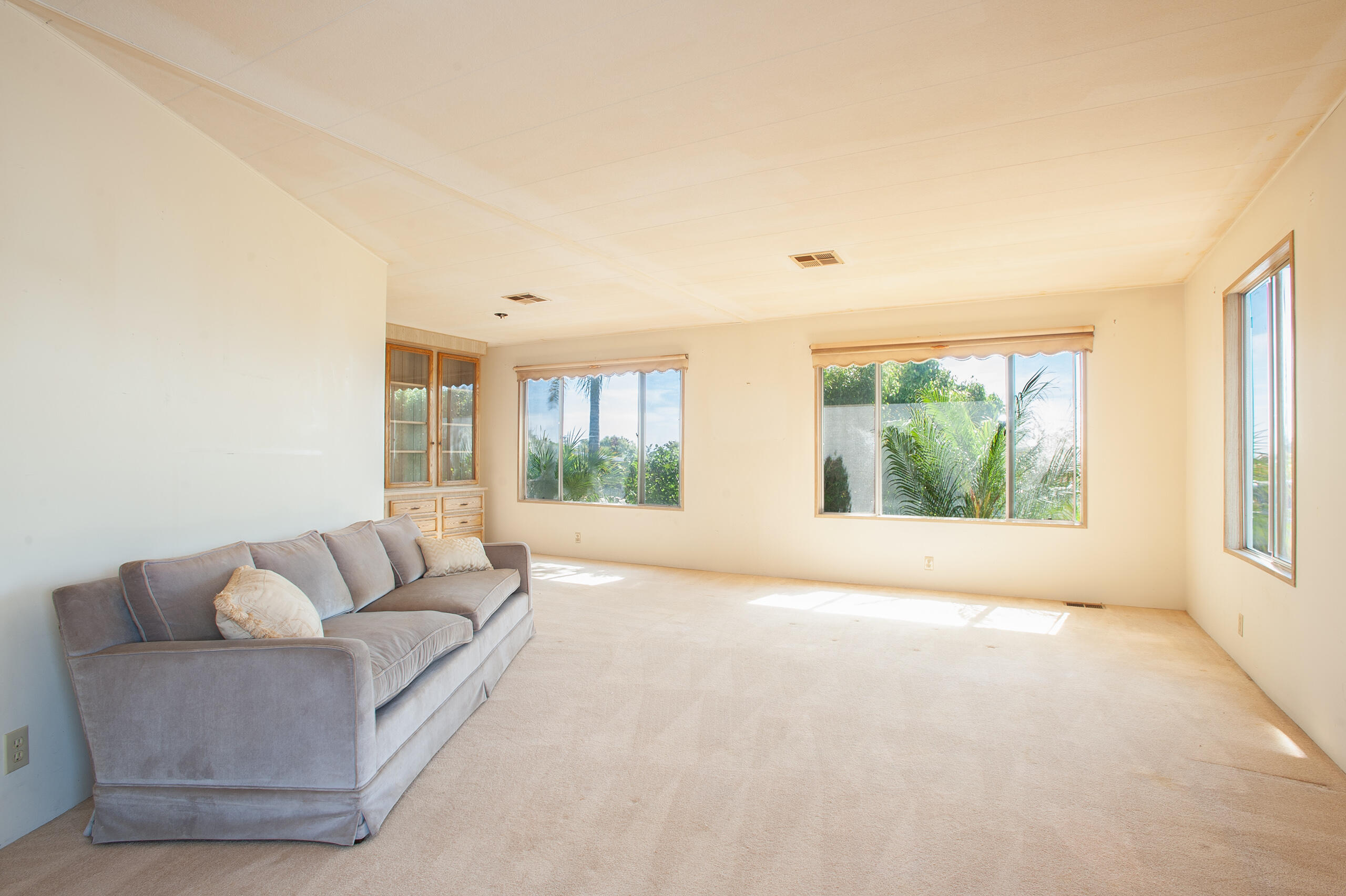 6180 Via Real, Unit 29 Carpinteria, CA 93013 - Photo 5 of 19 a living room with furniture and a large window