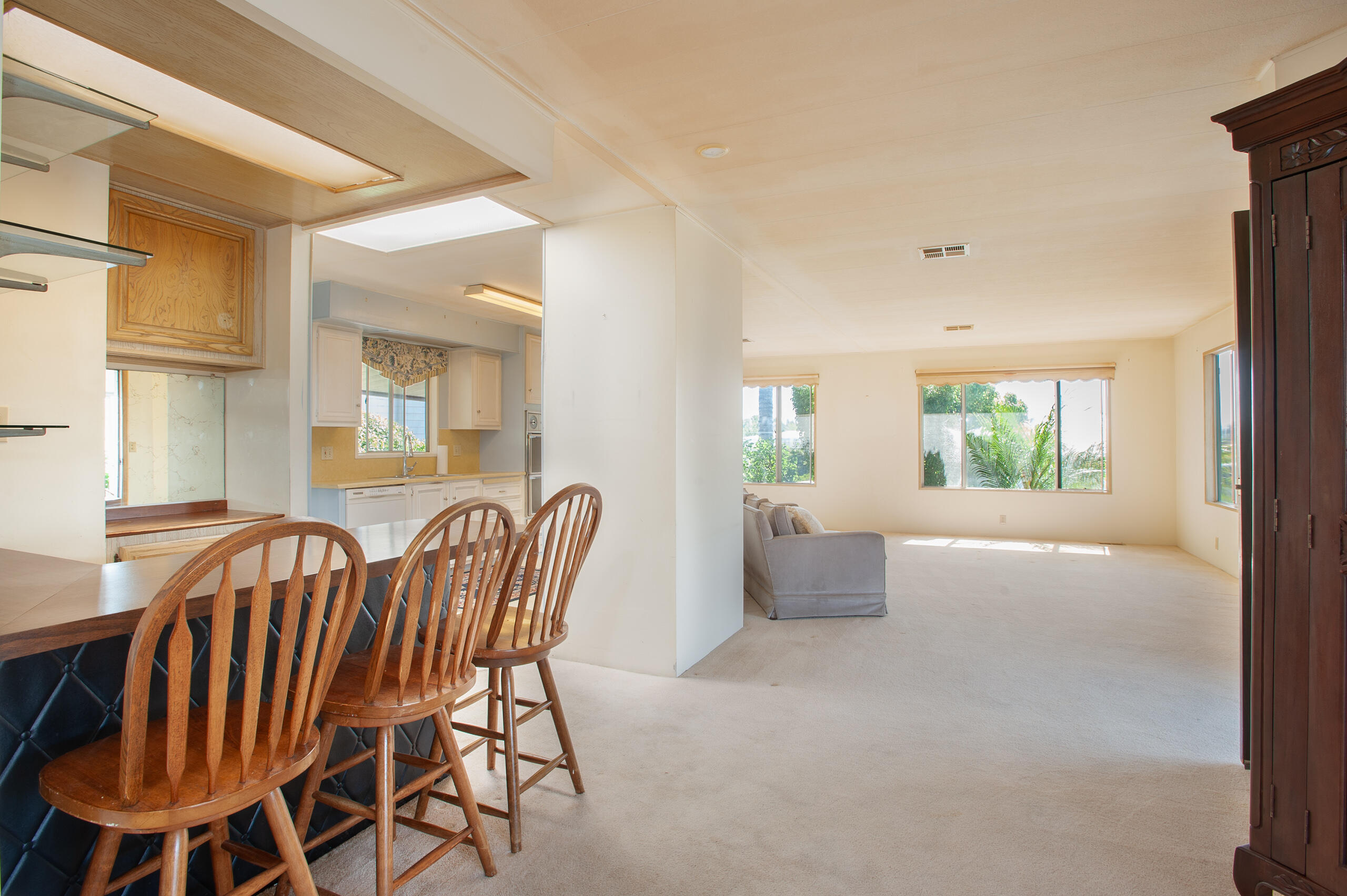6180 Via Real, Unit 29 Carpinteria, CA 93013 - Photo 7 of 19 a view of a dining room with furniture window and wooden floor