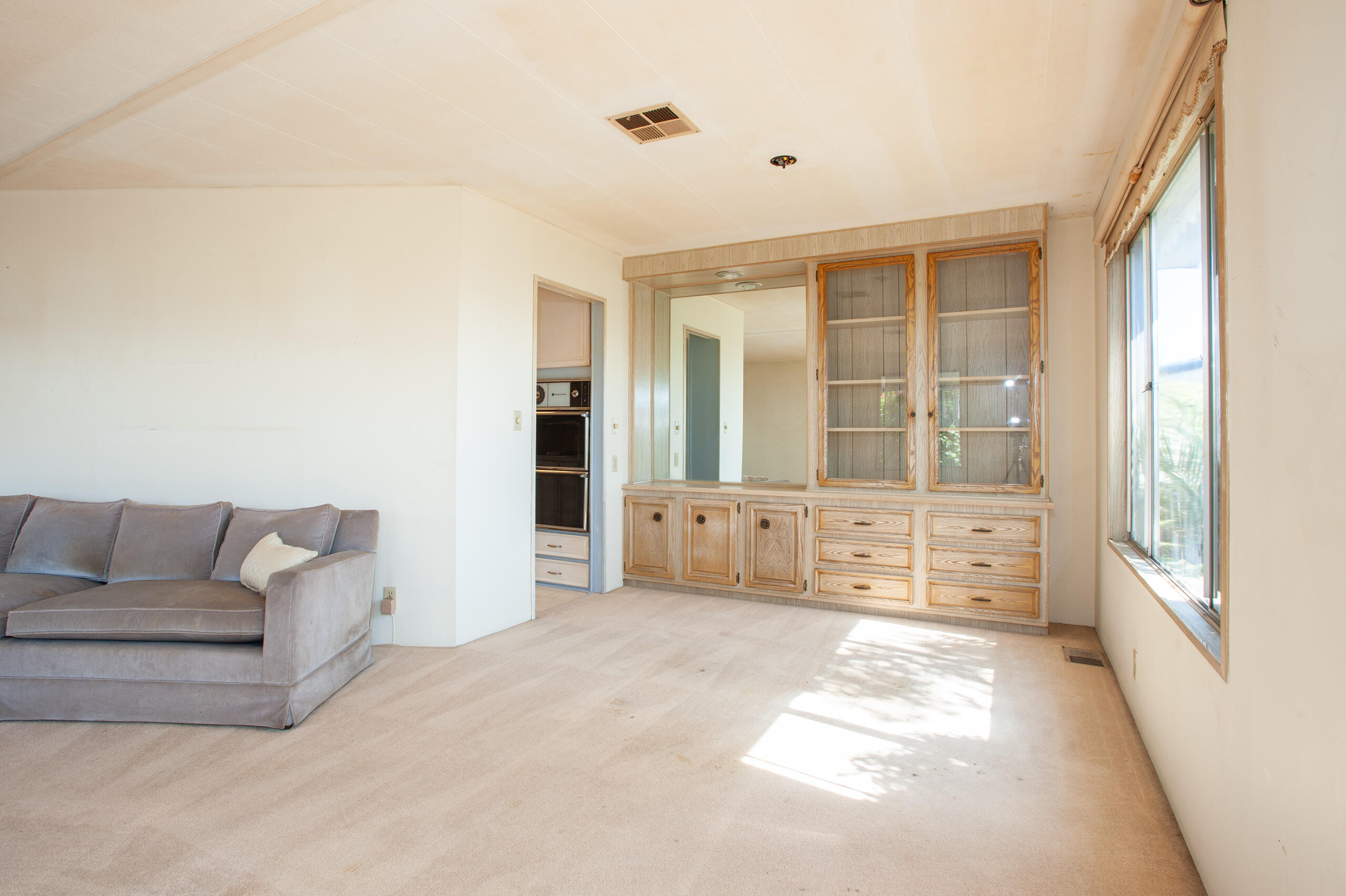 6180 Via Real, Unit 29 Carpinteria, CA 93013 - Photo 8 of 19 a living room with furniture and large windows