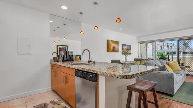a view of kitchen island a sink and living room