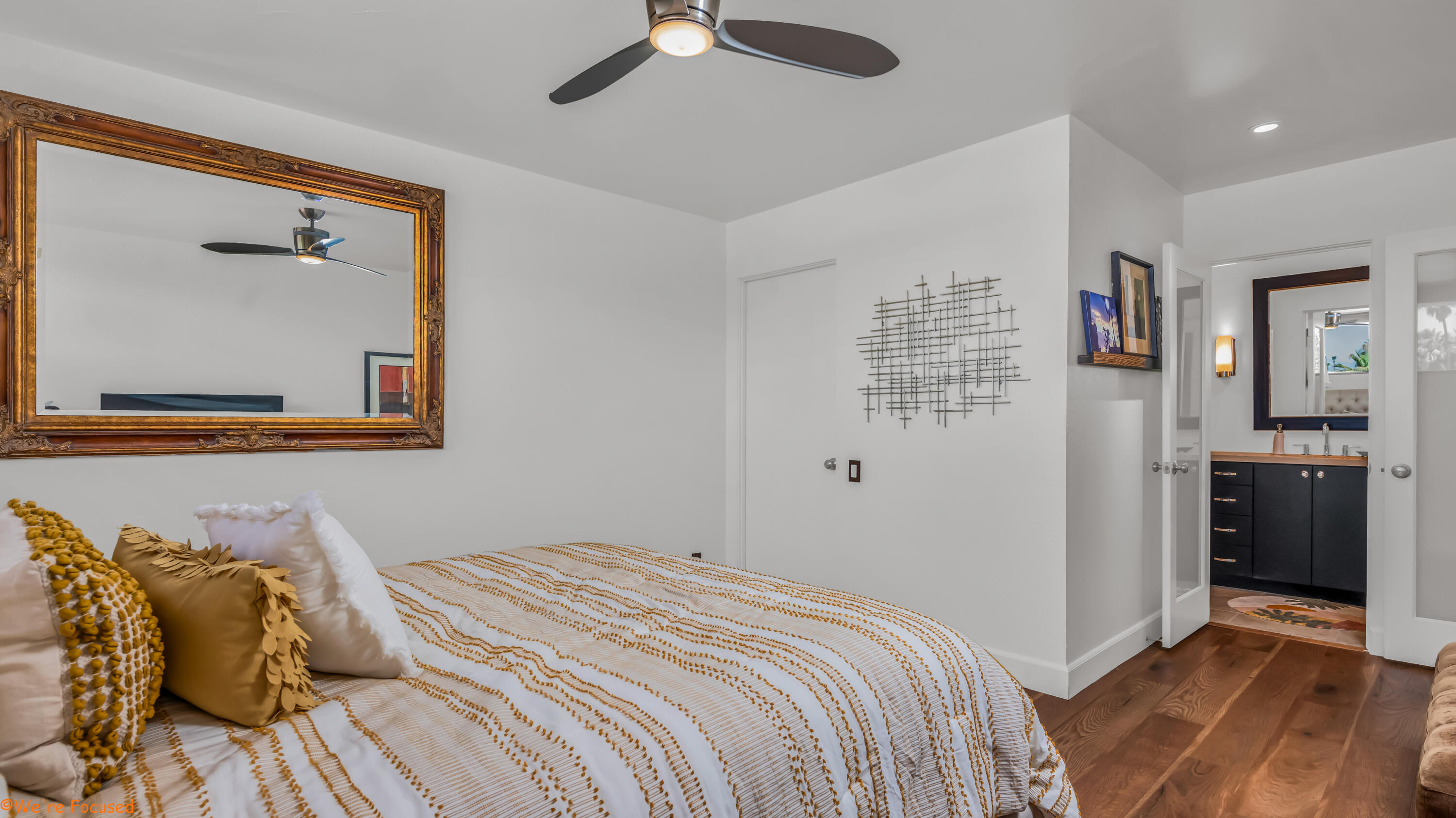 1655 East Palm Canyon Drive, Unit 202 Palm Springs, CA 92264 - Photo 17 of 26 a bedroom with a bed and a walk in closet