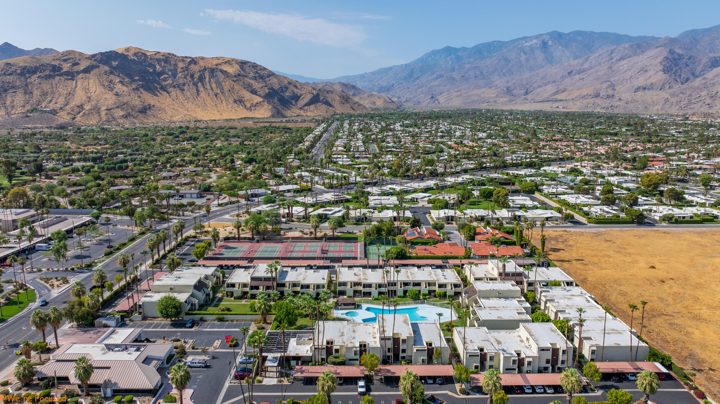 1655 East Palm Canyon Drive, Unit 202 Palm Springs, CA 92264 - Photo 24 of 26 an aerial view of multiple house