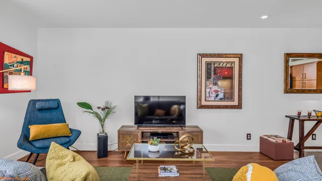 a living room with furniture and a flat screen tv