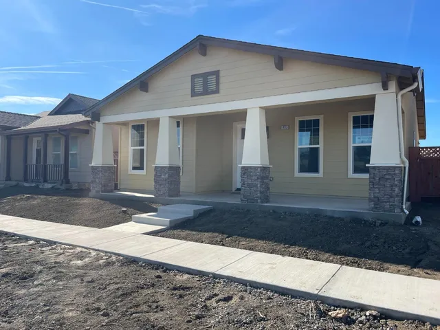 a front view of a house with yard