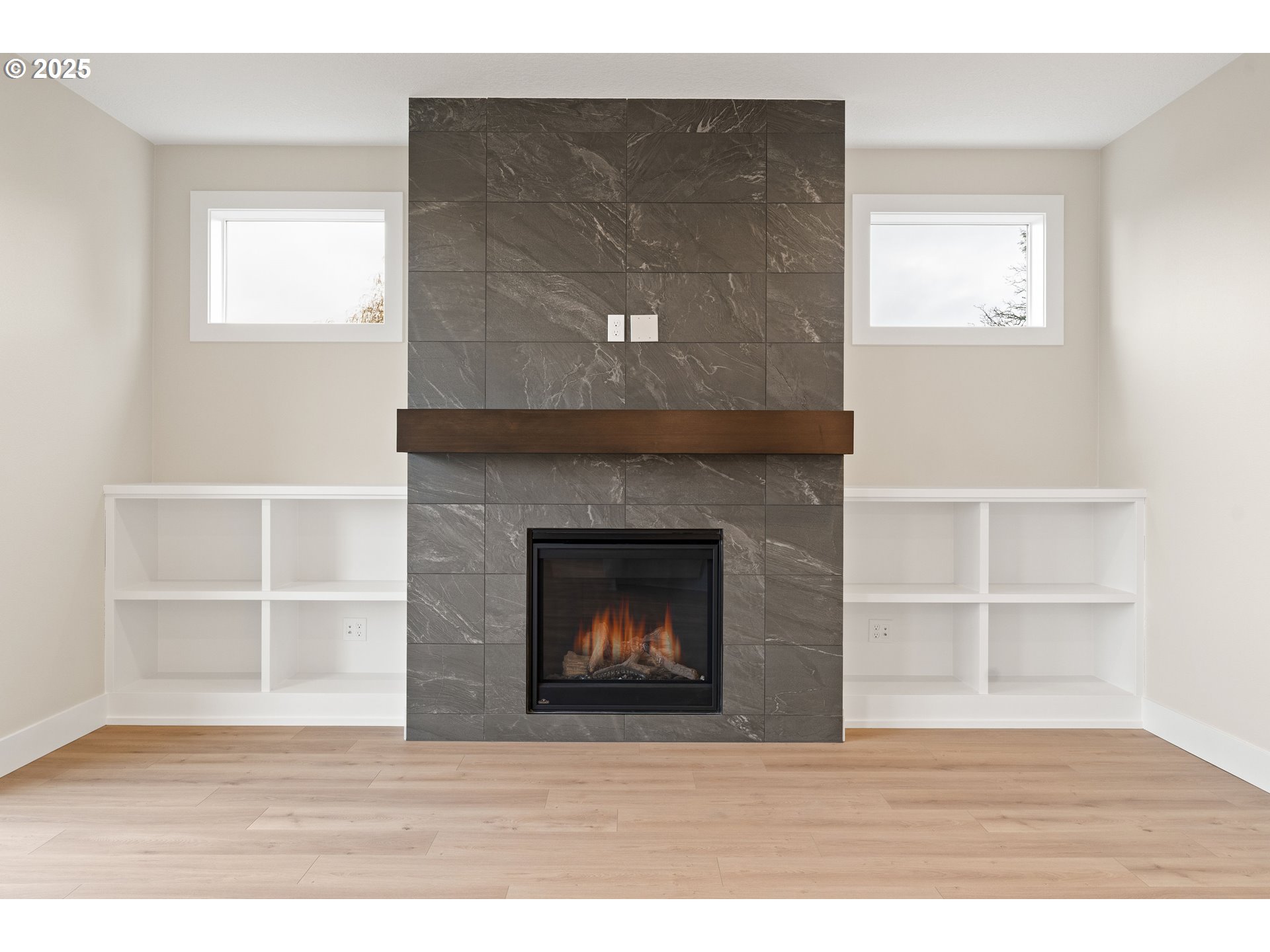 11486 Northwest Elise Lane Portland, OR 97229 - Photo 22 of 48 a room with a fireplace