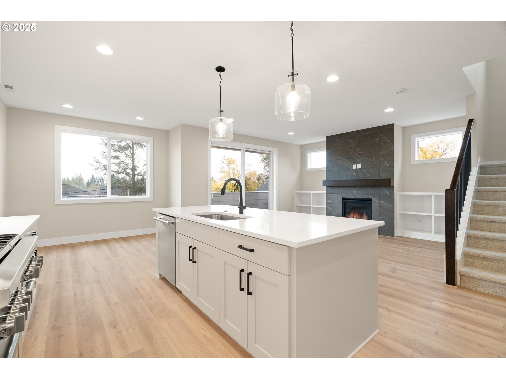 11486 Northwest Elise Lane Portland, OR 97229 - Photo 24 of 48 a kitchen with a sink a counter top space and a window
