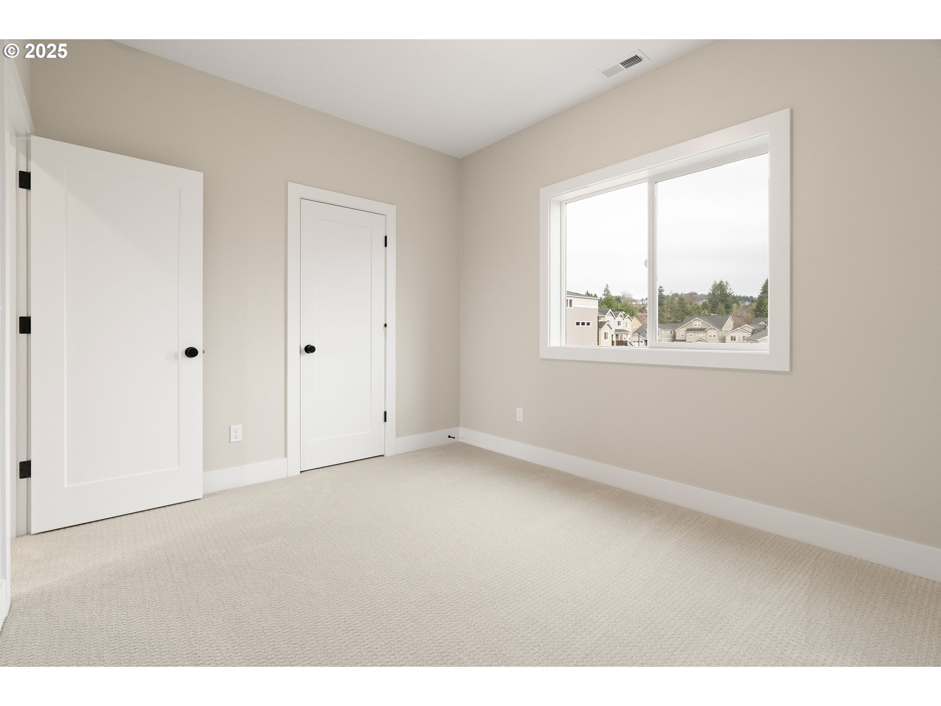 11486 Northwest Elise Lane Portland, OR 97229 - Photo 36 of 48 a view of an empty room with a window