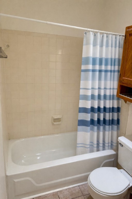 915 West 23rd Street, Unit 108 Austin, TX 78705 - Photo 12 of 15 Full bathroom with light tile patterned floors and shower / bath combination with curtain