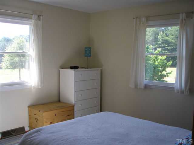 1716 Buckhorn Road Mebane, NC 27302 - Photo 8 of 20 Large second bedroom, home has split bedroom plan for privacy and comfort.