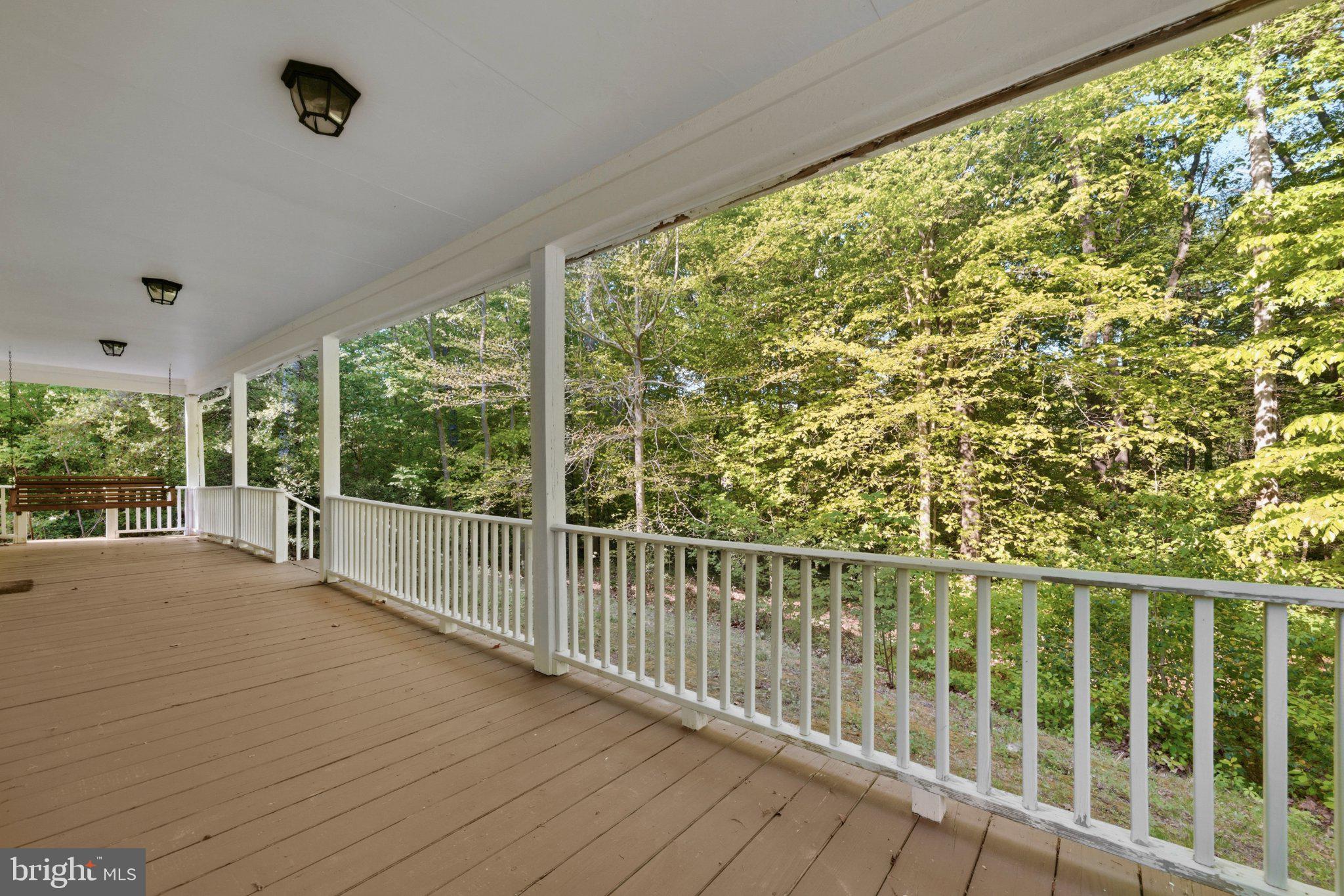 10560 South Faulkner Road Faulkner, MD 20632 - Photo 16 of 60 Serene porch overlooking lush greenery.