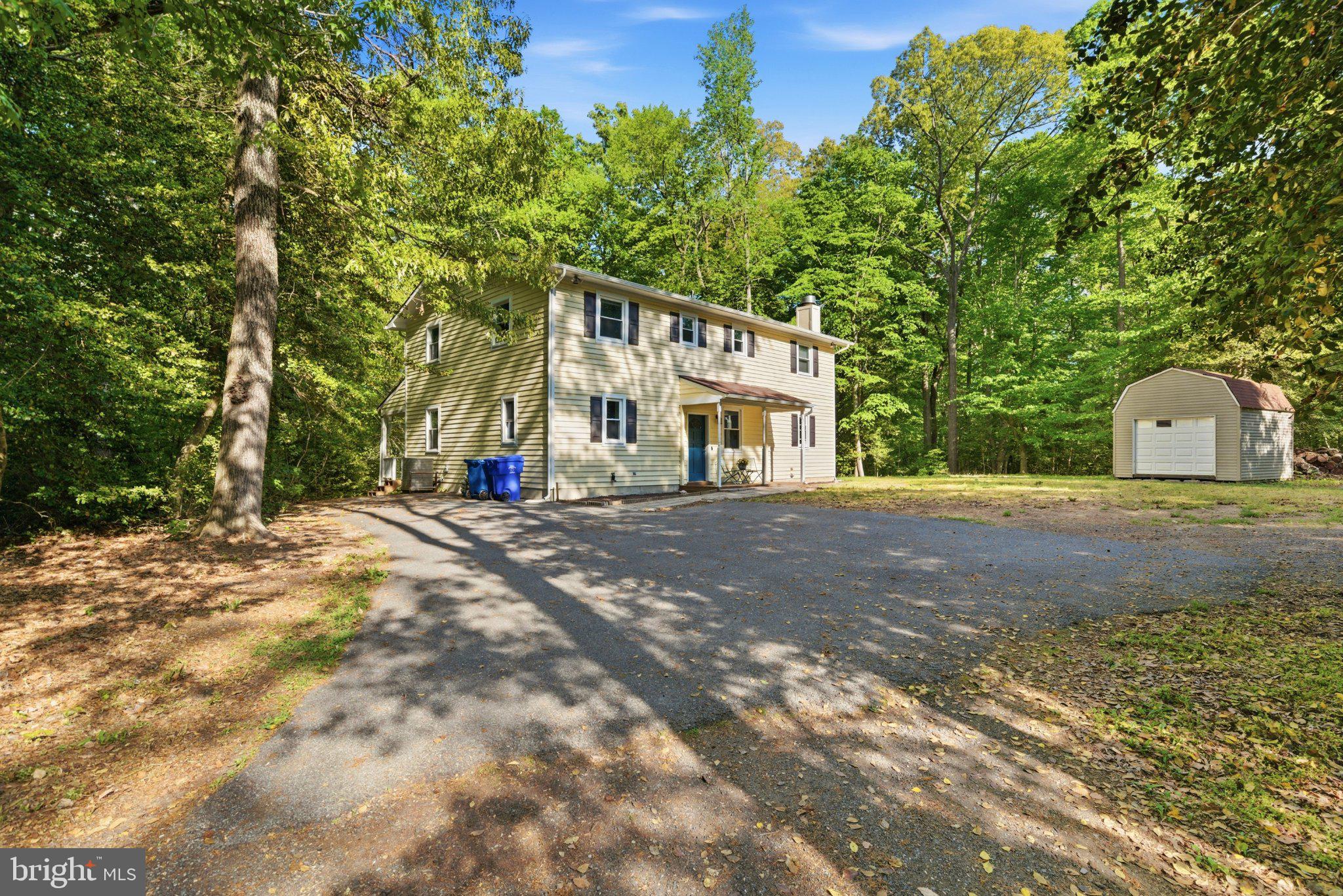 10560 South Faulkner Road Faulkner, MD 20632 - Photo 3 of 60 Charming home nestled in lush greenery.