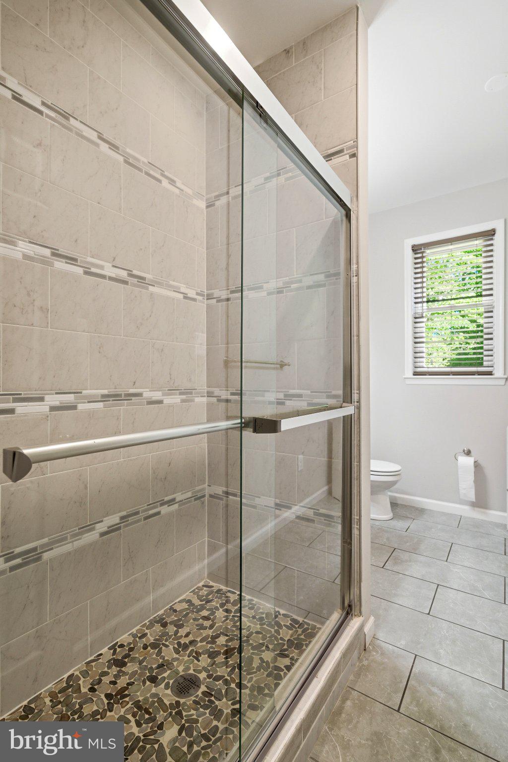 10560 South Faulkner Road Faulkner, MD 20632 - Photo 40 of 60 Sleek glass shower with natural stone.
