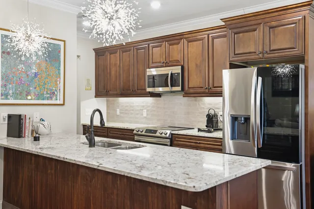 a large kitchen with a table and chairs
