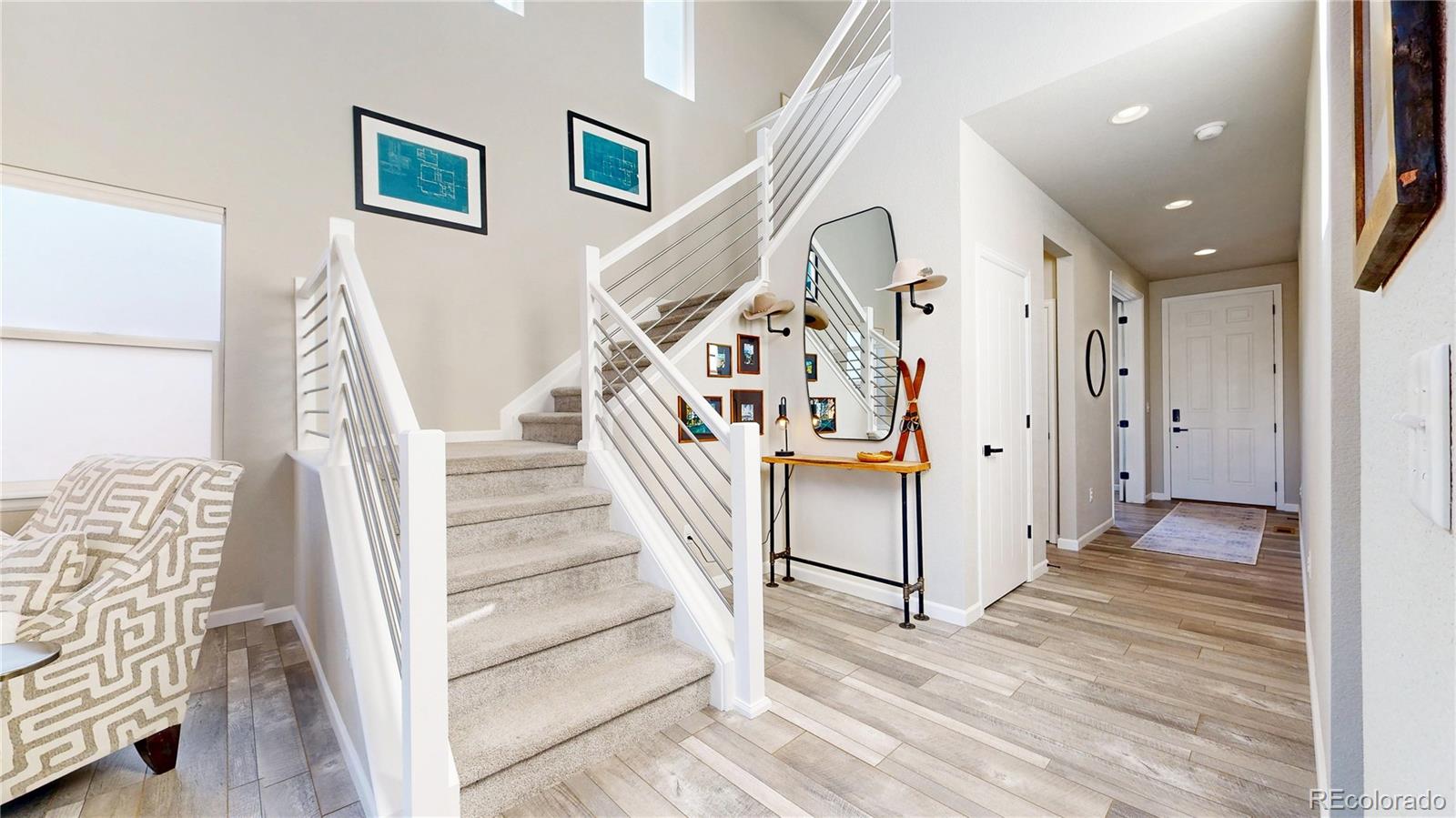 1107 Basalt Ridge Loop Castle Rock, CO 80108 - Photo 11 of 50 a view of entryway with stairs and wooden floor