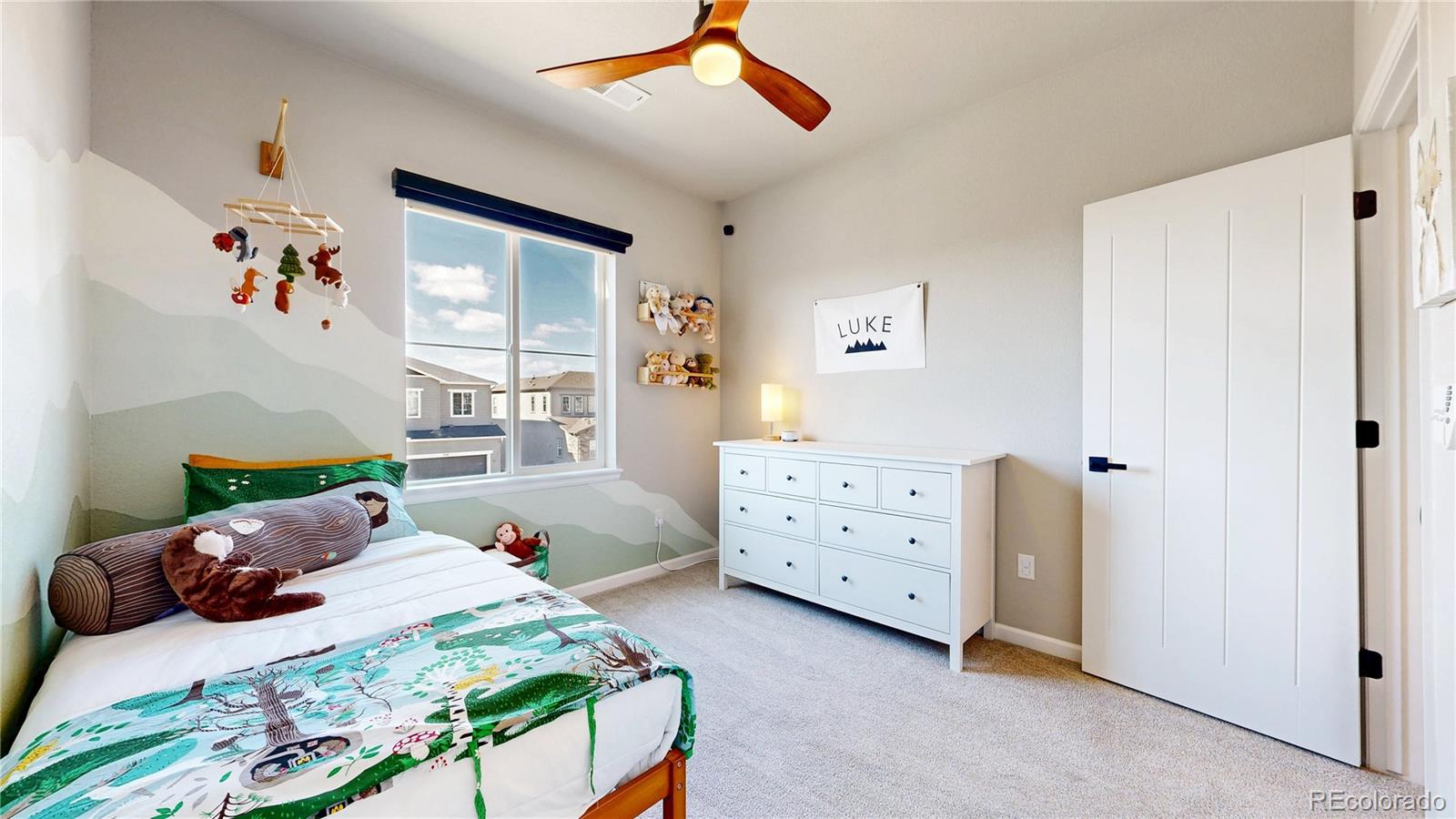 1107 Basalt Ridge Loop Castle Rock, CO 80108 - Photo 24 of 50 a bedroom with a bed and a window