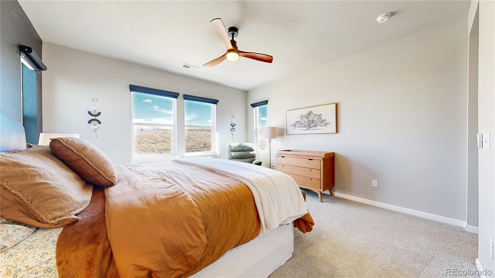 1107 Basalt Ridge Loop Castle Rock, CO 80108 - Photo 29 of 50 a bedroom with a bed and a window